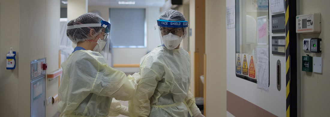 Clinical team putting on personal protecting equipment under COVID-19