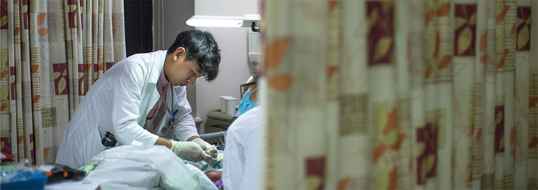 A doctor taking care of a patient