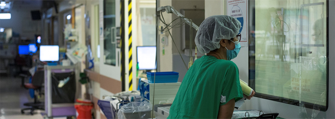 A nurse looking after a critically ill patient